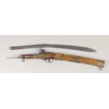 A RARE INDIAN TORODAR FLINTLOCK CARBINE, early 19th century, round 10in barrel with brass ring at