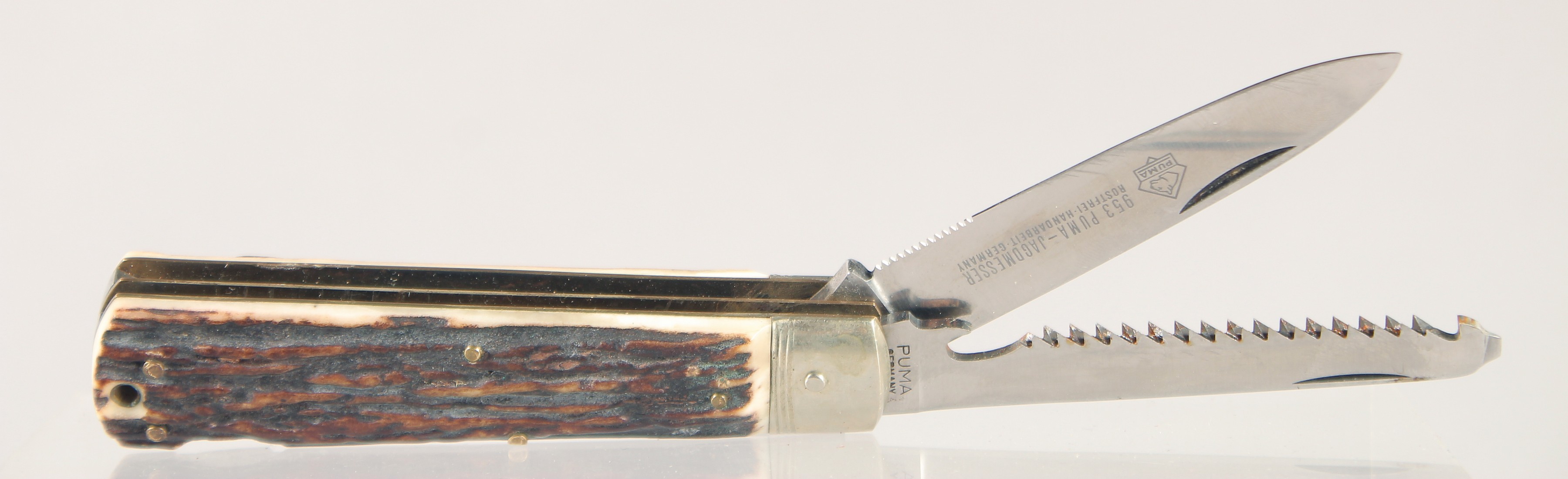 A PUMA ROSTFREI COMBINATION POCKET KNIFE, with antler handle, 4.5" long.