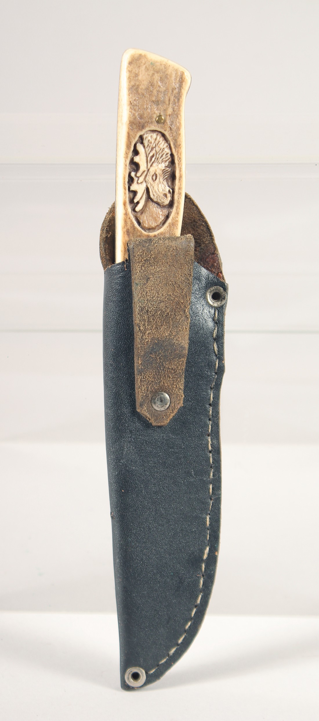 A KNIFE, with antler handle carved with a moose head, 9" long, in a leather sheath. - Image 5 of 5