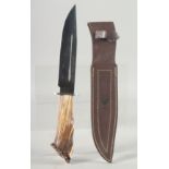 A MUELA SARRIO SPANISH KNIFE, with an antler handle, 13" long in a leather sheath.