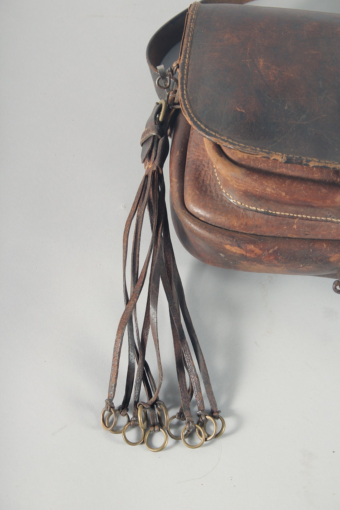 A LEATHER BAG AND STRAP. - Image 2 of 3