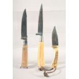 THREE KNIVES, with bone and antler handles.