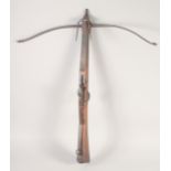 AN ENGLISH STONE BOW, circa 1770, beech stocked with iron mounts, iron bow, folding fore sight,