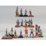 A COLLECTION OF TWENTY FIVE VARIOUS METAL SOLDIERS, on a stand, (25).