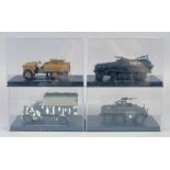 FOUR VARIOUS ARMORED VEHICLES, boxed.