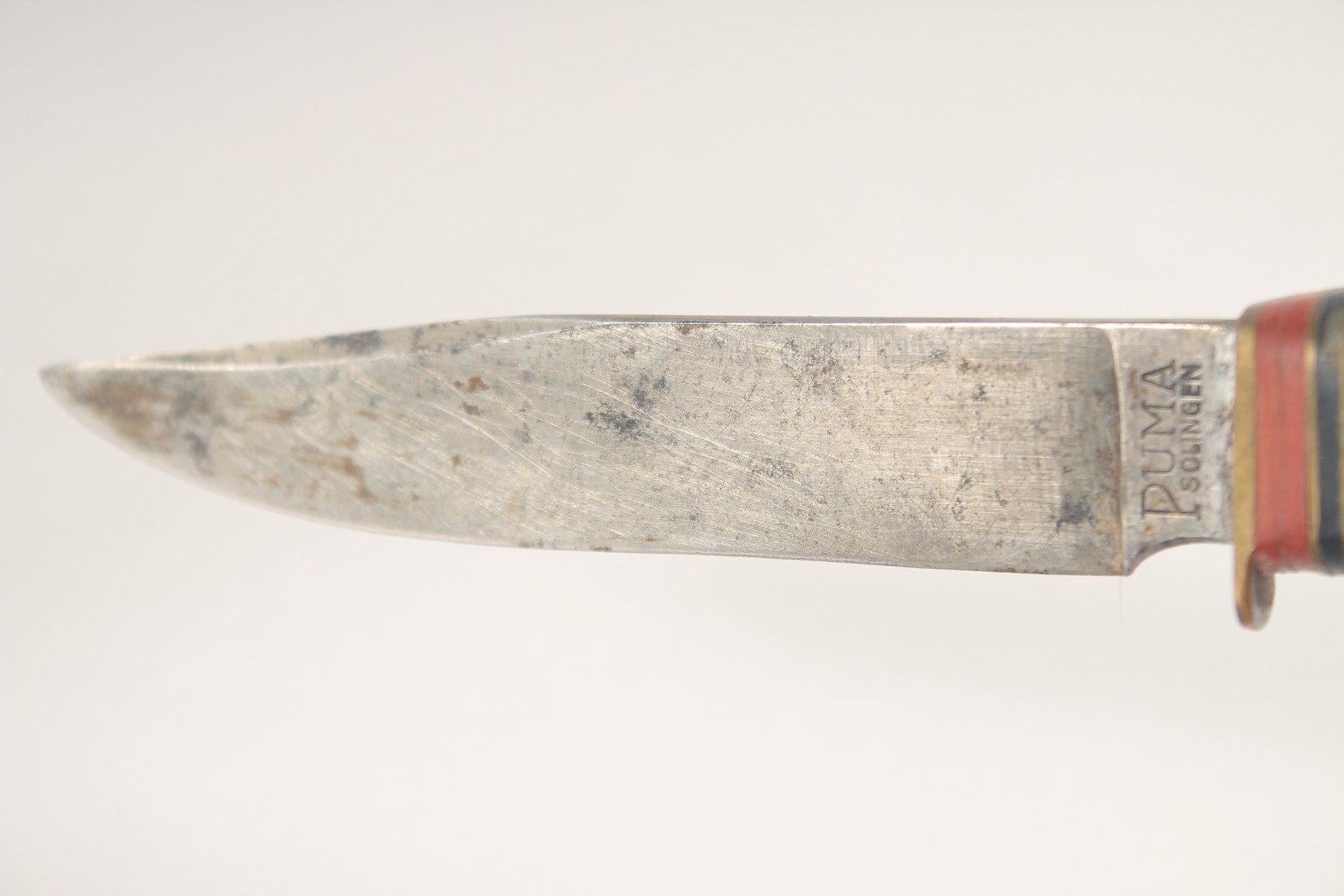 A PUMA KNIFE, with antler handle, in a leather sheath, 7.5" long. - Image 2 of 4