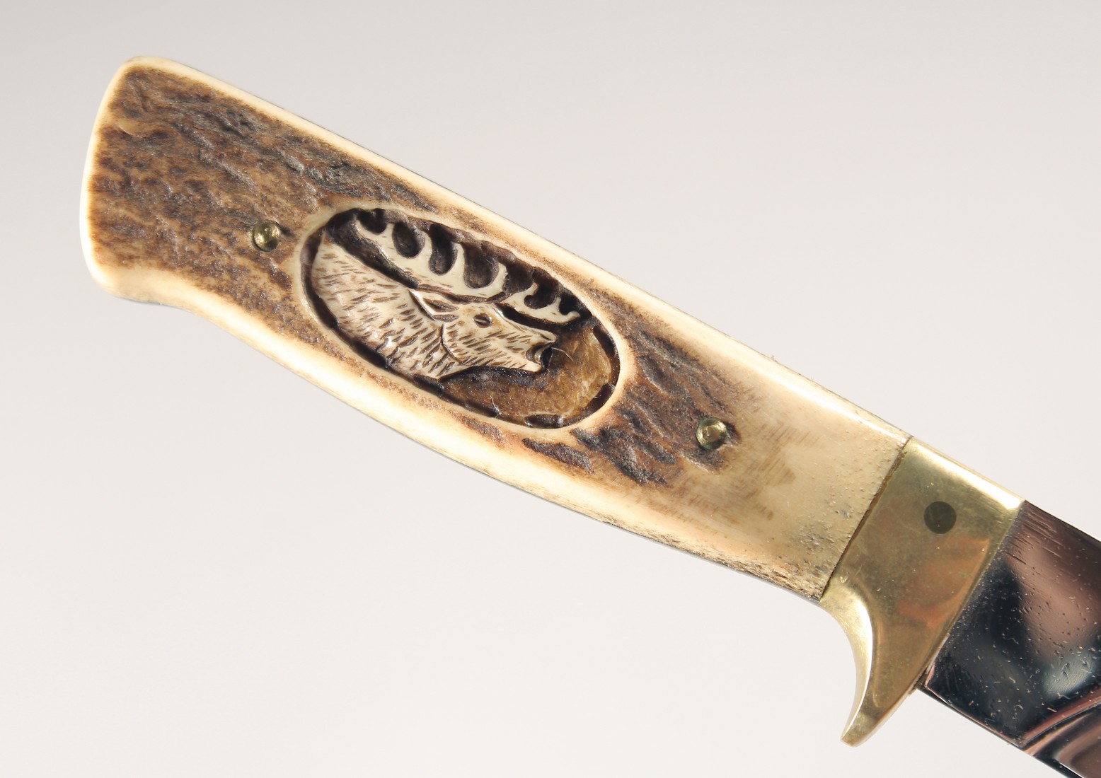 A KNIFE, with antler handle carved with a moose head, 9" long, in a leather sheath. - Image 4 of 5