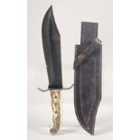 A GRIZZLY STAG 89008 PUMA KNIFE, with antler handle, 13" long in a leather scabbard.