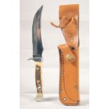 THE 637 PUMA-SKINNER KNIFE WITH SUPER KEEN CUTTING STEEL, with antler handle, in a leather sheath,