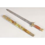 A CHINESE SHORT SWORD, late 19th century double edged blade, brass mounts with fluted grip, brass