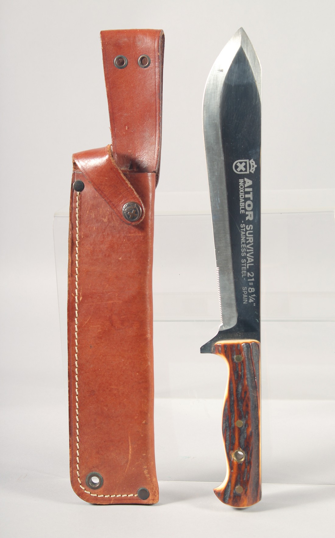 AN AITOR SURVIVAL 21 8.75 STAINLESS STEEL KNIFE, with antler handle in a leather sheath.