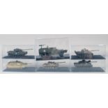 SIX VARIOUS DIECAST TANKS AND TRUCKS, in a Perspex case.