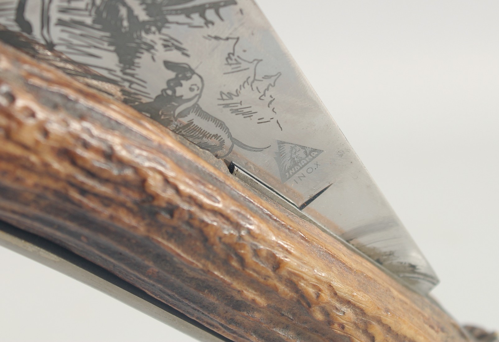 INDIANA INOX, A LARGE HUNTING KNIFE, the blade engraved with two deer and a dog, blade 12" with a - Image 6 of 7