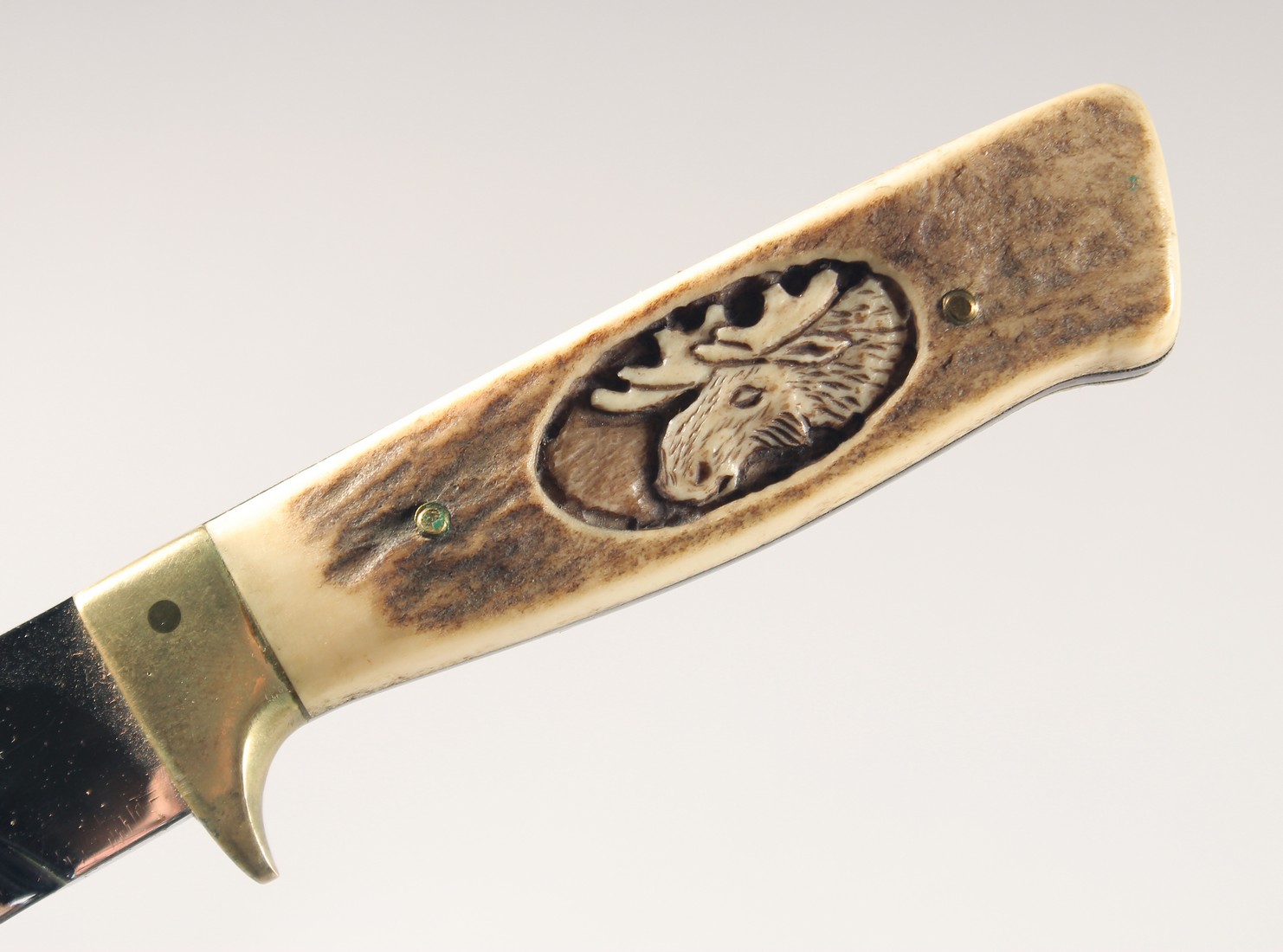 A KNIFE, with antler handle carved with a moose head, 9" long, in a leather sheath. - Image 3 of 5