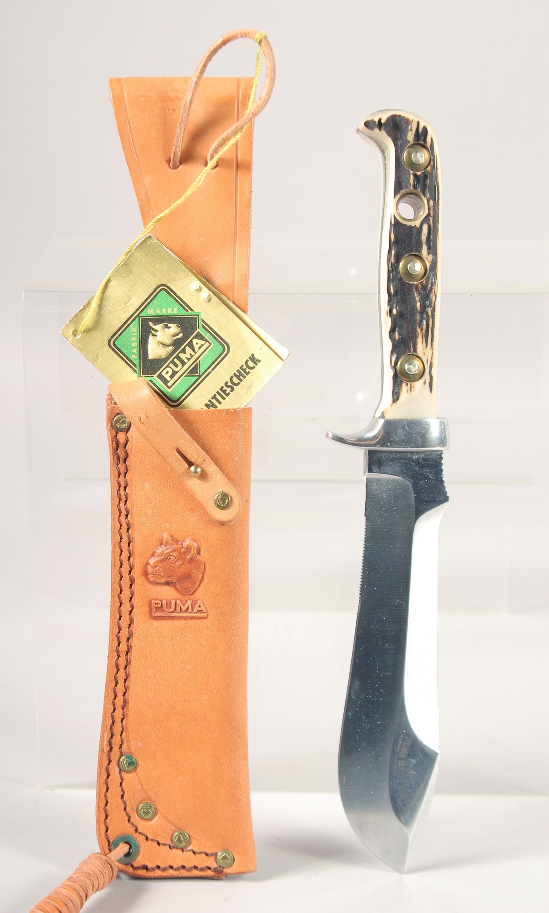 A PUMA WHITE HUNTER KNIFE 6377, with antler handle in a leather sheath, 10" long.