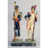 A PAIR OF HUSSARS, 13" high.