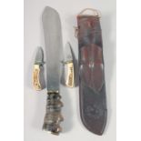 A SUPERB J.J.B. 1943 MACHETE, with fossilized wood handle, 20" long, in a leather scabbard.
