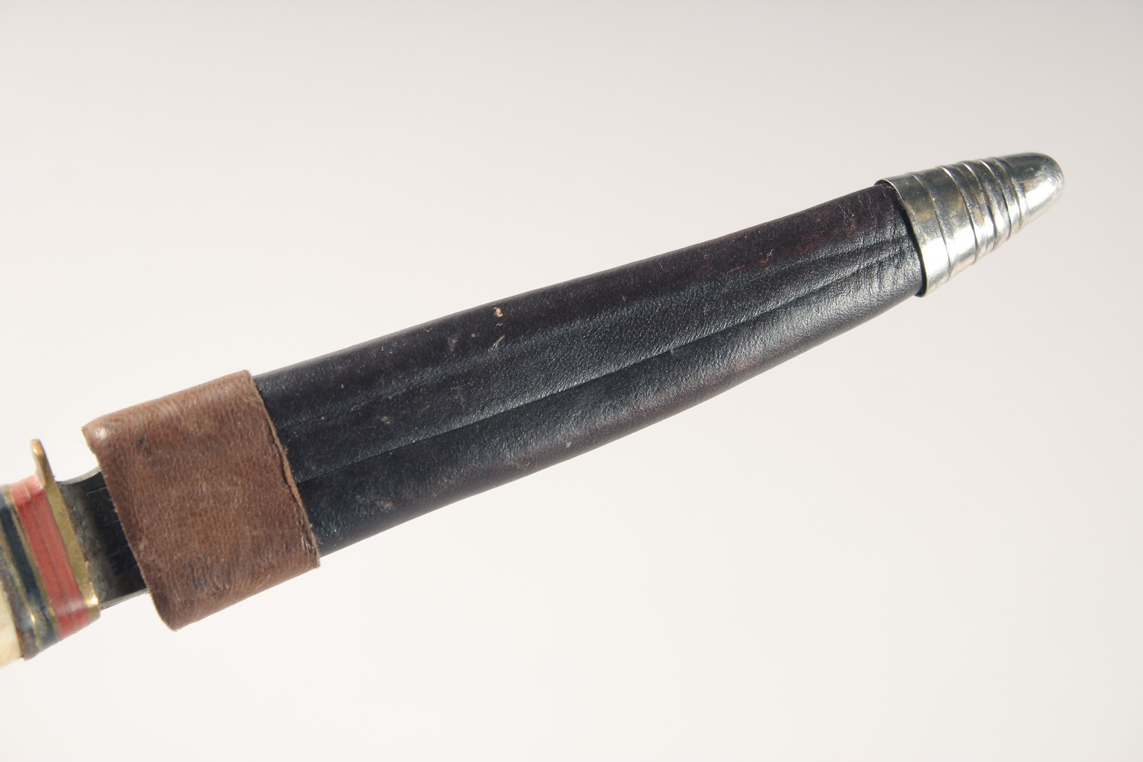 A PUMA KNIFE, with antler handle, in a leather sheath, 7.5" long. - Image 4 of 4