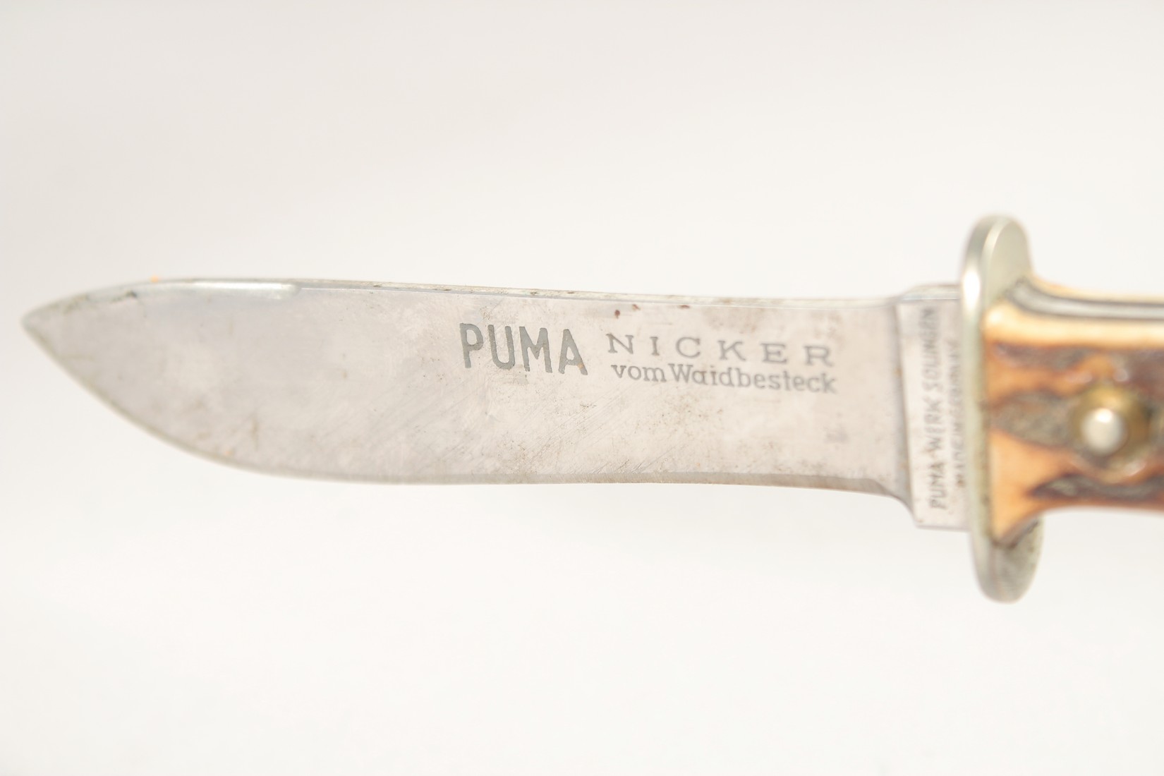 A PUMA NICKER SOLINGEN KNIFE, with antler handle in a leather sheath,7.5" long. - Image 3 of 4