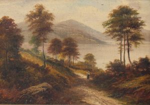 G. Willis Pryce (1866-1949) British, A landscape view of a figure on a path leading down to a lake