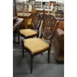 A set of six shield back dining chairs, two with arms.