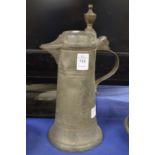 A pewter lidded jug.