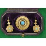 A Victorian circular yellow metal brooch mounted with turquoise stones together with a pair of