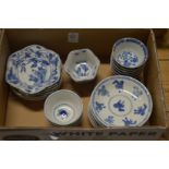 A collection of Chinese blue and white tea bowls and saucers.