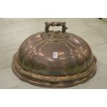 A large and impressive plated meat dome with engraved armorial.