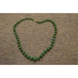 A malachite bead necklace.