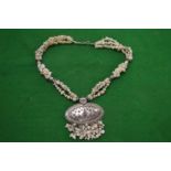 A highly ornate necklace.