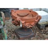 A good set of three large terracotta classical shaped pedestal garden urns/planters.