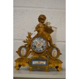 A French spelter mantel clock with porcelain panels.