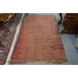 An old Bokhara carpet, worn 7' x 4' 1".