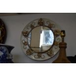 Decorative circular mirror.