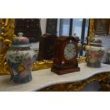 A pair of colourfully decorated Chinese temple jars and covers.