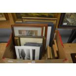 A box of paintings and prints.