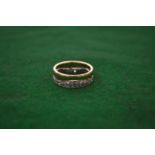 A 18 carat gold and diamond double hoop eternity ring.