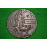 A WWI bronze death penny awarded to Robert William Spencarn Meakins.