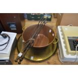 A brass tray, copper preserve pan and a set of three fireside tools.