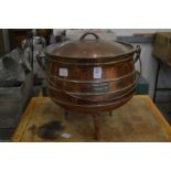 A heavy cast metal cauldron style cooking pot with lid, marked Falkirk size 5.