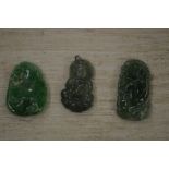 Three Chinese carved jade amulets.
