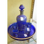 Blue glass liqueur set.