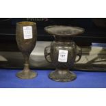 An Indian engraved brass vase and a similar goblet.