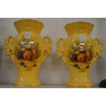 A pair of Aynsley limited edition fruit decorated twin handled vases.