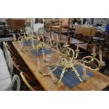 A set of three good quality heavy brass eight branch chandeliers.