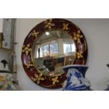 Decorative circular mirror.