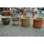 Four various garden planters.