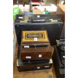 Three metal cash boxes and an attache case.