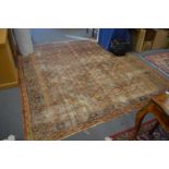 An old Persian carpet, worn 9' 6" x 8' 9".